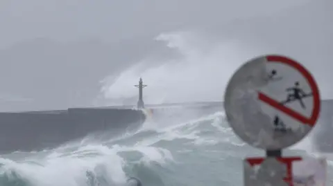 Reuters Waves break against the protecting walls as Typhoon Gaemi approaches in Keelung, Taiwan July 24, 2024. 