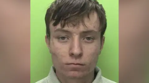 Custody photo of Matthew Ward with short brown hair
