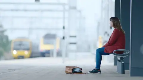 Small Talk Saves Lives Woman sat on train platform