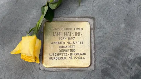 Michael Sturrock A brass plaque which reads 'In Edinburgh lived Jane Haining Born 1887 arrested 14.5.1944 Budapest Deported Auschwitz-Birkenau Murdered 17.7.1944