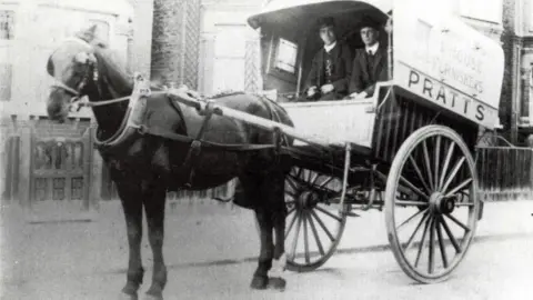 Getty Images Horse and wagon with the name Pratts on the side