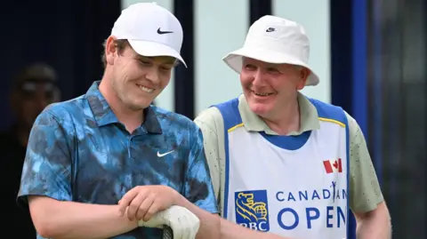 Reuters Robert MacIntyre with his father Dougie