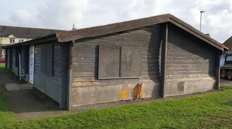 A wooden hut formerly used as changing rooms for two local football clubs