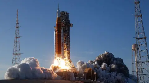 NASA NASA’s Space Launch System rocket carrying the Orion spacecraft with astronauts on board