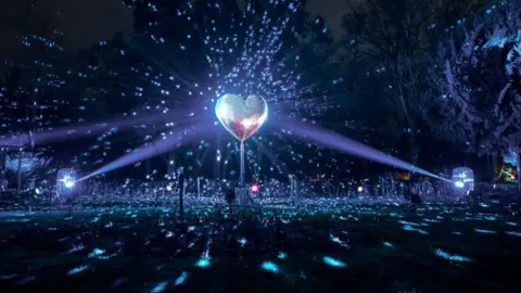 Secret Bristol / Bristol Light Festival A heart-shaped disco ball in the dark with light reflecting off it.