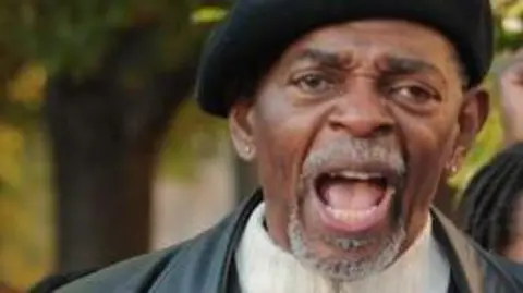 Getty Images Activist Omali Yeshitela (R), in Washington on 7 November 2009