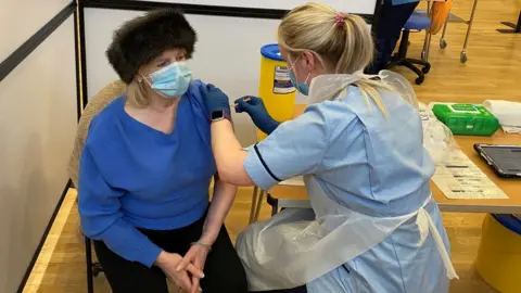 NHS Lanarkshire Rosemary McGlone receives her vaccination at Fernhill Community Centre in Rutherglen