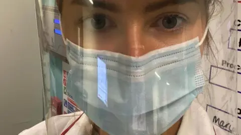 Northern Care Alliance NHS Group Salford Royal staff wearing the protective visors