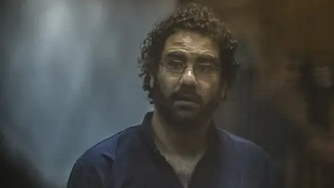 AFP File photo showing Alaa Abdel Fattah in court in March 2015