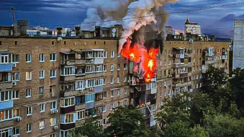 A residential building on fire in Kharkiv, north-eastern Ukraine, after Russia's overnight aerial attack