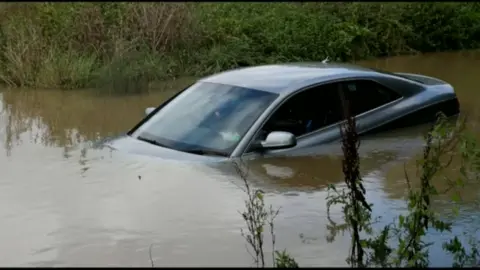Stephen Huntley Car in flood water
