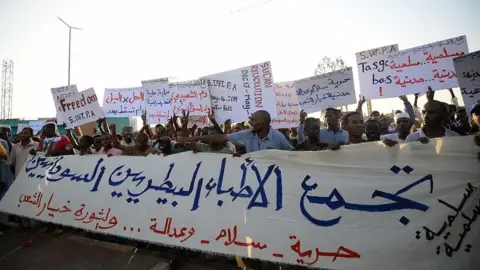 AFP Sudanese protesters chant slogans and wave placards during a demonstration in Khartoum on May 14, 2019