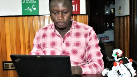 BBC/Peter Njoroge Alex Magu at the headquarters of the Stem Impact Centre in Nairobi, Kenya