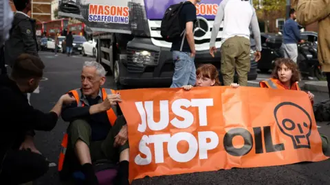 HENRY NICHOLLS/Reuters Just Stop Oil protest in London