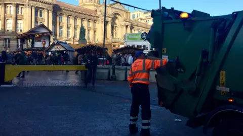 Bin worker by the Christmas market