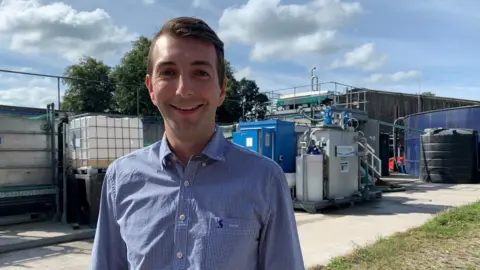 Natural Resources Wales Marc Williams in front of equipment