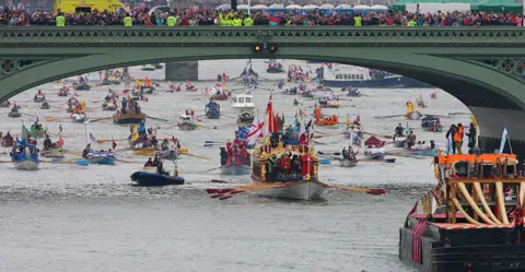 Getty Images Gloriana - Her Majesty's Royal Barge heads the historic flotilla of 1,000 boats along the Thames river in June 2012