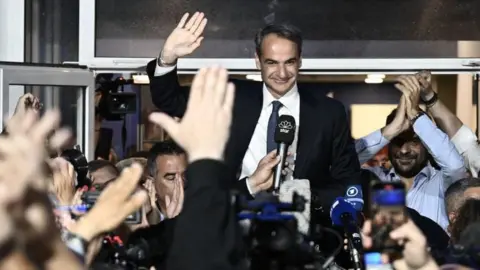 Aris Messinis/AFP Prime Minister and New Democracy party's leader Kyriakos Mitsotakis celebrates with his supporters