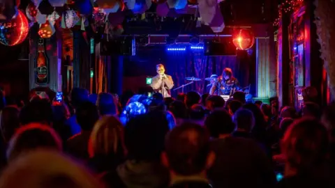 Getty Images The Butterfly Museum perform at the Night And Day Cafe