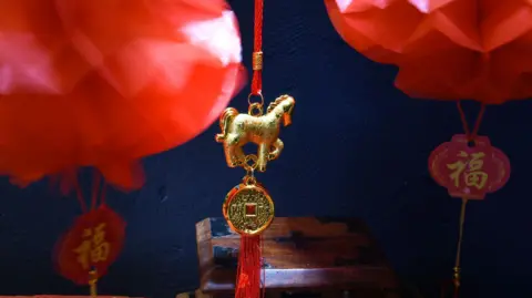 Chinese new year celebrations, including a decoration featuring a golden horse.
