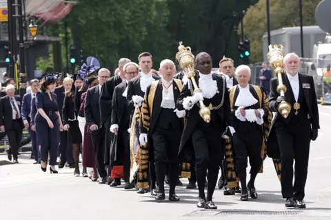 Stefan Rousseau/PA Media MPs and peers walk in procession from the Palace of Westminster in London to Westminster Abbey for a Service of Thanksgiving on the 80th anniversary of VE Day.
