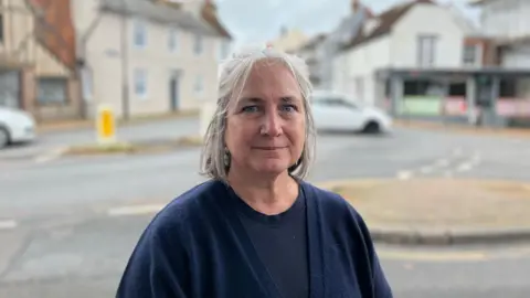 George Carden / BBC  Resident Sandra Bandirali stood in front of the High Street where the weight limit is