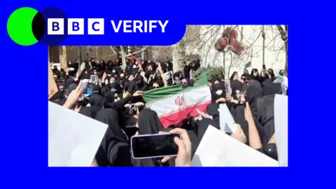 Promo Verify image showing students at Tehran's al-Zahra University set the flag of the Islamic Republic on fire 
