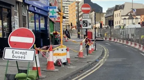 Roadworks on Wembley High Road with no entry signs.
