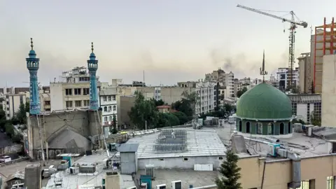 Mobile phone photo shows smoke rising in Tehran, Iran (17 June 2025)