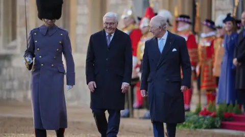 Getty Images King Charled takes a stroll with German President Frank-Walter Steinmeier outside Windsor Castle. 