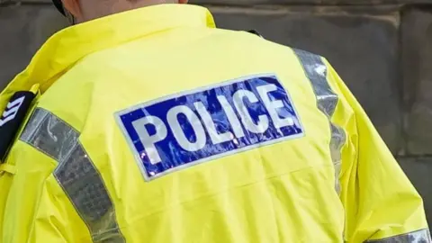 Getty Images The back of a policeman's coat