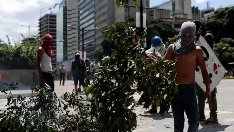 Reuters Demonstrators block a street at a rally against Venezuelan President Nicolas Maduro's government in Caracas, August 8, 201