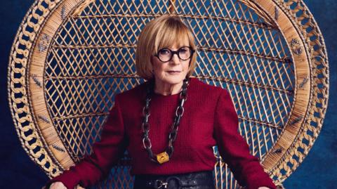 Anne Robinson sitting in a chair on the front cover of June's Saga magazine