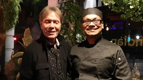 Blue Monk Nepalese & Indian Restaurant Cliff Richard with the chef