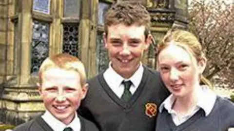 Scarisbrick Hall School Three school-aged children in shirts, ties and a jumper. The middle is a young Fleetwood.