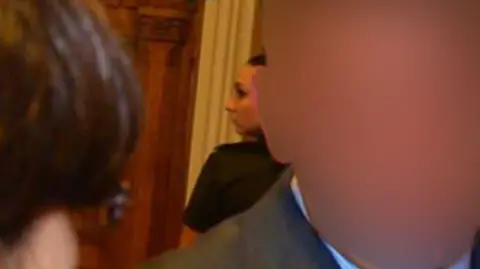 Facebook Katrin Ivanova (centre), behind a man whose face is blurred
