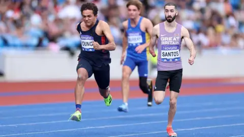 Getty Images Three men racing on athletics track