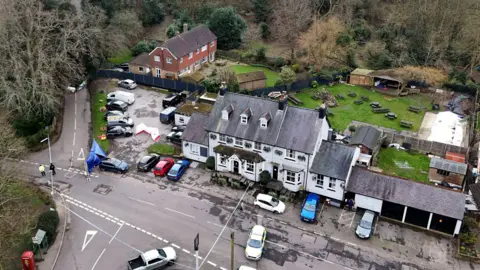 PA Media A white pub is seen from above. Its garden is visable in the background. 