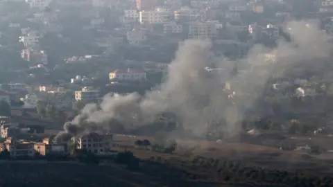 Reuters Smoke was pictured rising from the southern Lebanese town of Khiam, amid ongoing hostilities between Hezbollah and Israeli forces