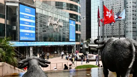 Getty Images Bull statues are seen on the Exchange Square complex, which houses the Hong Kong Stock Exchange