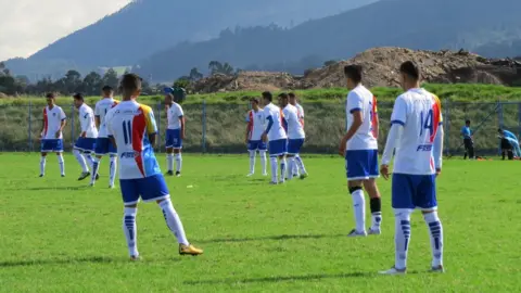 BBC La Paz F.C. players warm up before the game