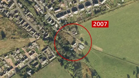 Google Earth A satellite image of the site located in Innerleith near the Scottish Borders. The site is marked with a red circle in the centre and the year '2007' is also marked to the right, in red and white. It looks like a domestic area around the site and there does not appear to be much on it.