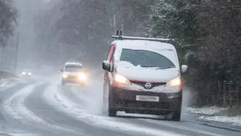 Michael Traill Cars drive in snow near Lumsden, Aberdeenshire