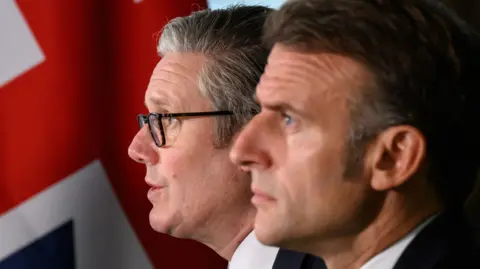 Keir Starmer and Emmanuel Macron with a backdrop of the Union flag