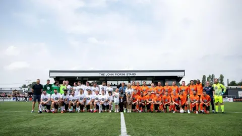 Getty Images Players in front of the John Fiorini Stand ahead of the 2023 charity match