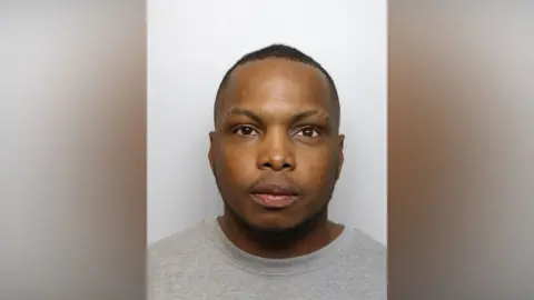 A police mugshot of Omarie Adams.