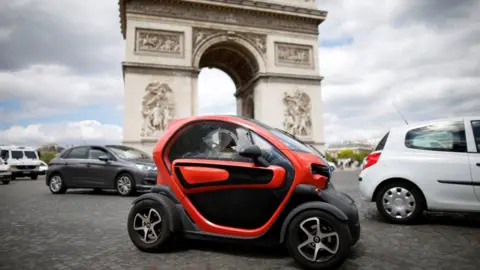 Reuters An electric car from Renault drives past the Arc de Triomphe in Paris on 30 May 2017