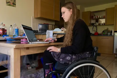 Martin Giles/BBC Katy Shaw studying