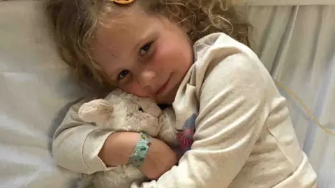 GoFundMe Ivy holding a rabbit