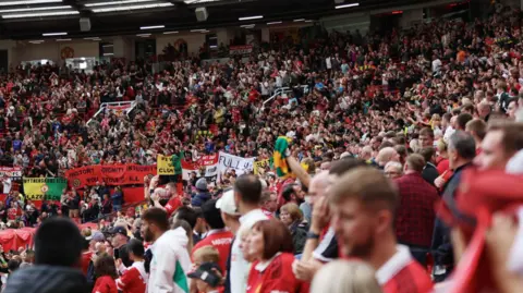 Reuters Manchester United away supporters during a match at Nottingham Forest's City Ground stadium